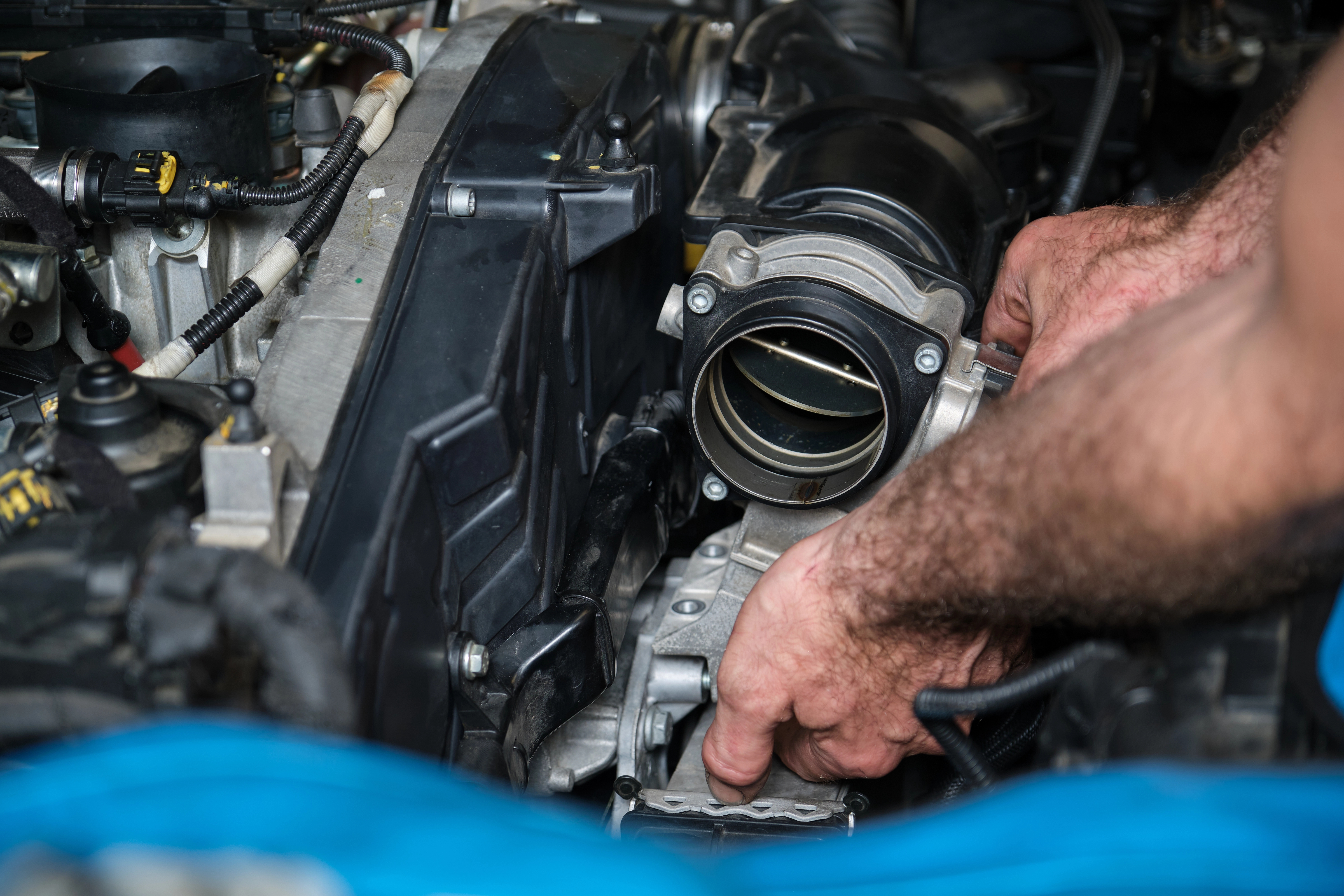 Engine repair in McKinney, TX — ASE-certified mechanic servicing engine at Economy Transmission and Automotive Repair