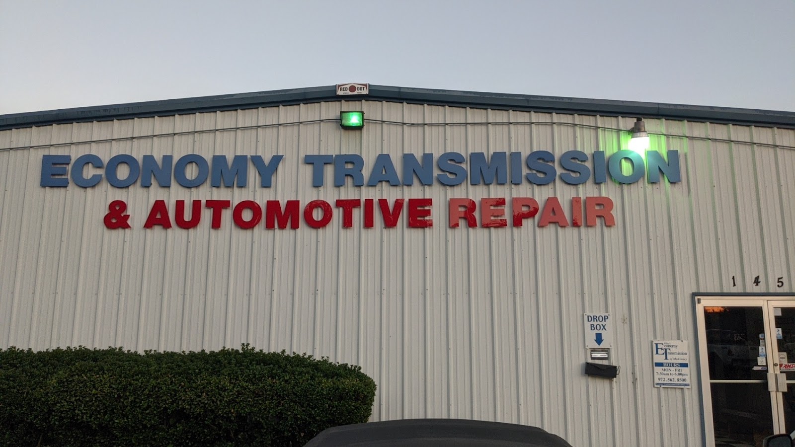 Economy Transmission and Automotive Repair signage — official Texas inspection station
